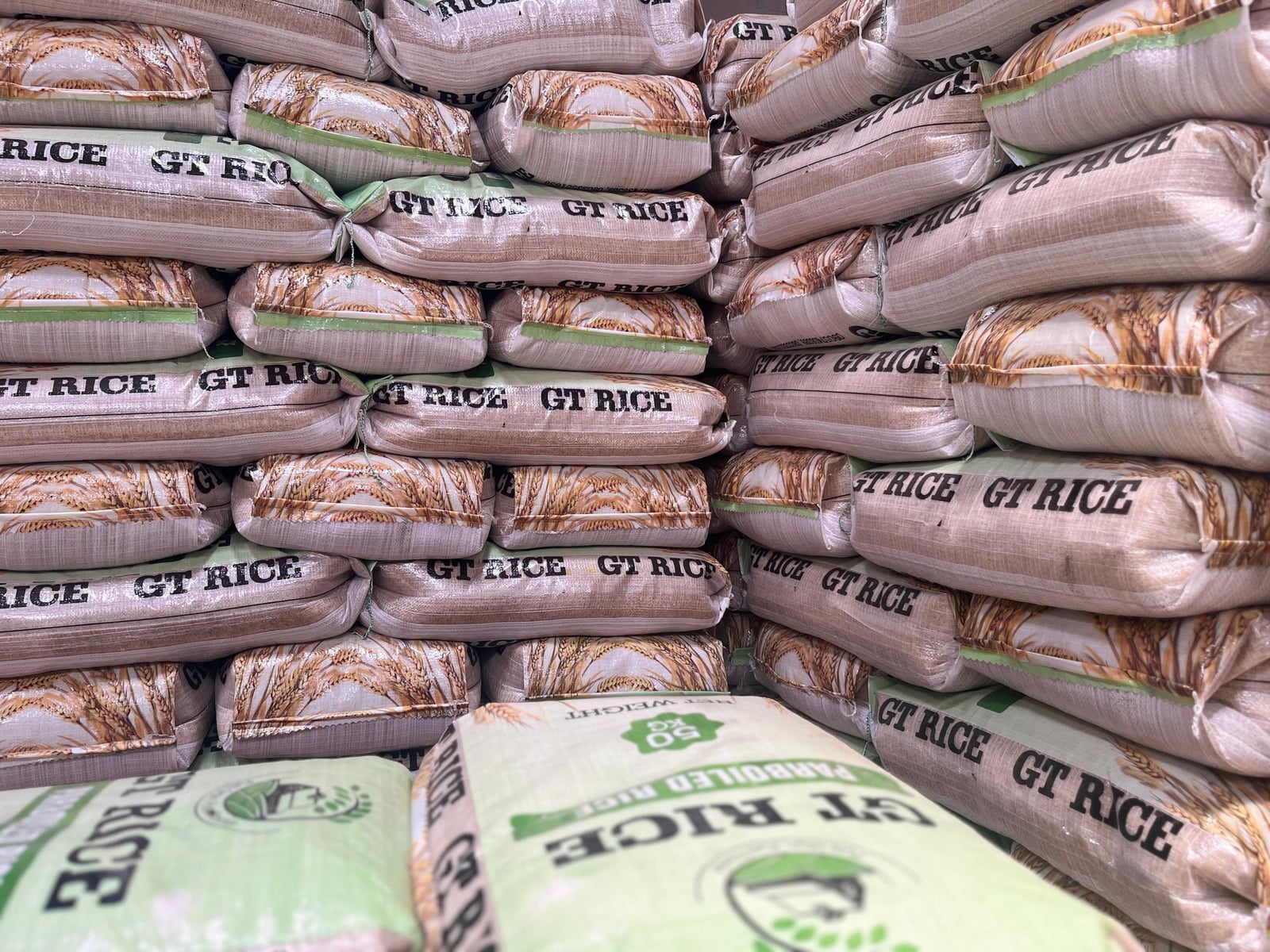 Stacked parboiled rice bags ready for wholesale delivery